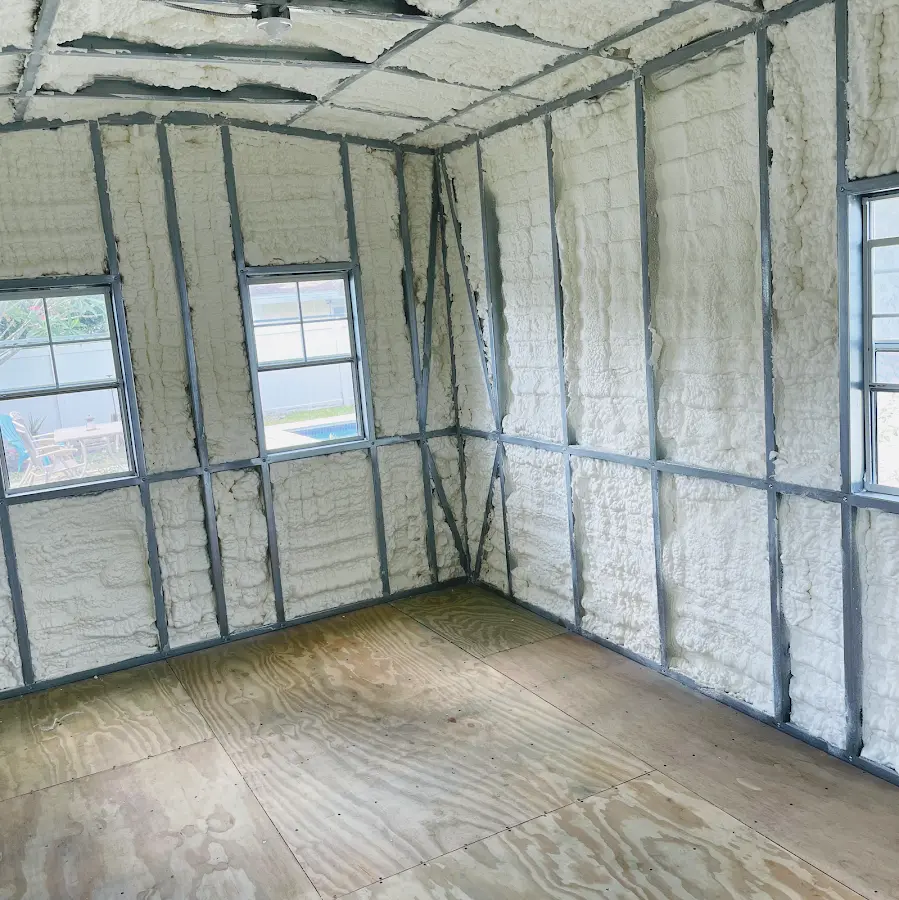Closed-cell spray foam insulation applied to wall cavities in a residential project in Auburn